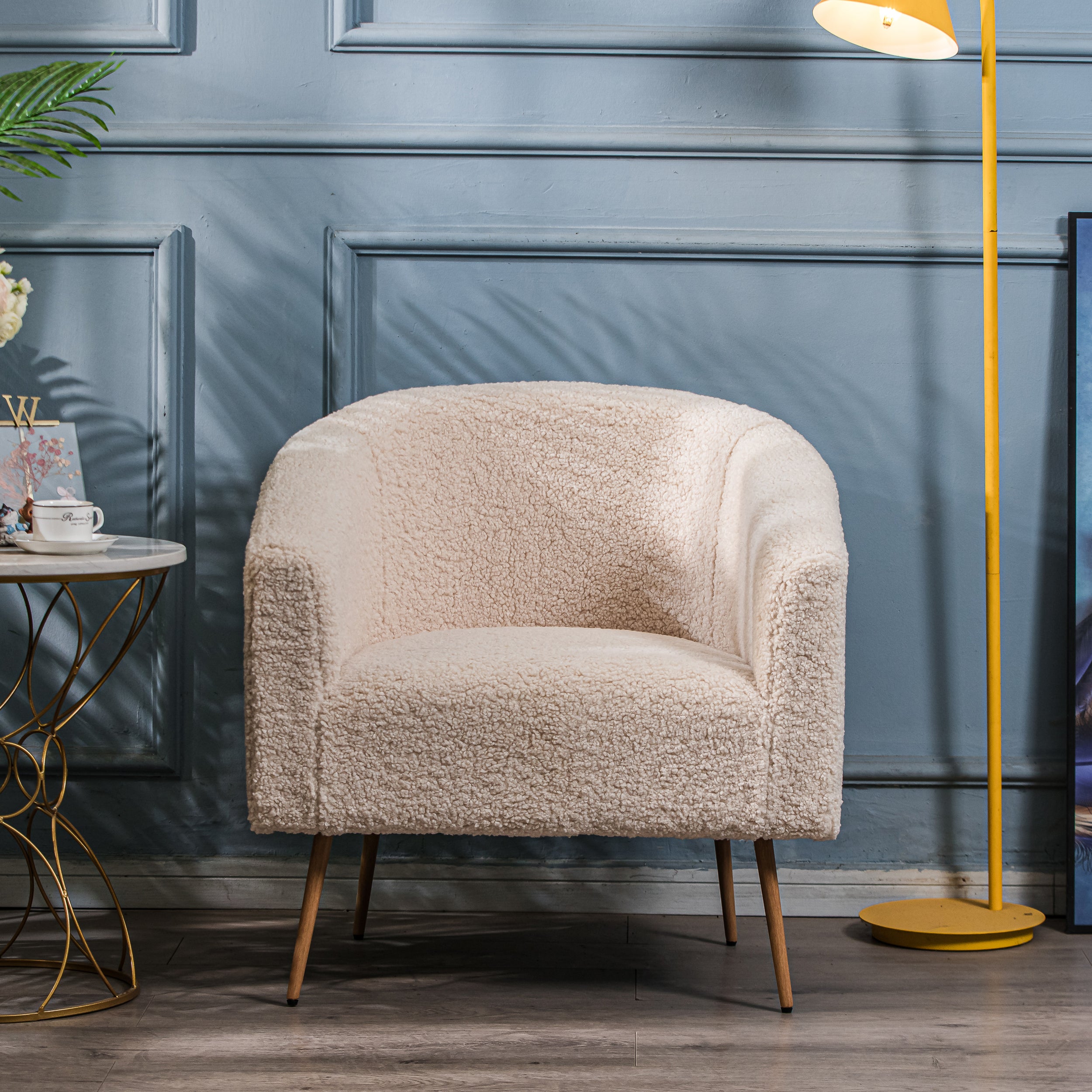 Fotel salonowy z metalu i białymi pętelkami